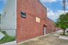 View of side of property with brick siding