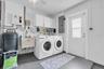 Laundry area inside garage