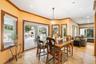 Dining room with recessed lighting, stone tile floors, and ornamental molding