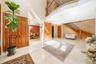 Entryway featuring stairs, arched walkways, and a towering ceiling