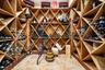 Wine room featuring stone finish floors