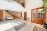 Foyer entrance featuring stairs, french doors, arched walkways, a towering ceiling, and recessed lighting
