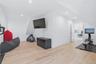 Versatile bonus room featuring light wood-finish flooring, recessed lighting, and crisp white walls