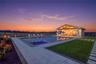 Pool house with vaulted ceilings and exposed wood beams