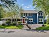Welcome to the main house with a wonderful rocking chair front porch and expansive driveway that fits 5 cars!