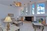 Cathedral windows flood the family room with light
