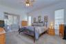 Primary suite privately tucked away on its own side