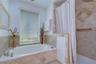 Beautifully updated en-suite with custom tile work