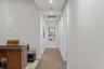 Hallway leading to additional beds/baths, and laundry.