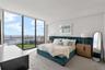 Primary suite with water views. Electric designer shades included on all windows.