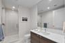 Bathroom #2 with upgraded mosaic tile in hallway