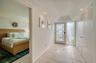 Clean bright hallway entrance to master bedroom