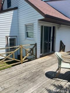 back of house with large deck area for summer fun