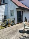 back of house with large deck area for summer fun