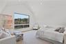 Guest studio suite with full bath above one of the two detached garages