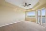 Primary bedroom with balcony access