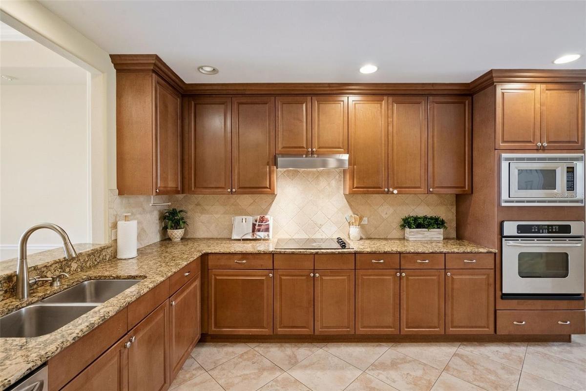 Kitchen with wood cabinetry and granite countertops