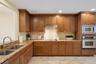 Kitchen with wood cabinetry and granite countertops