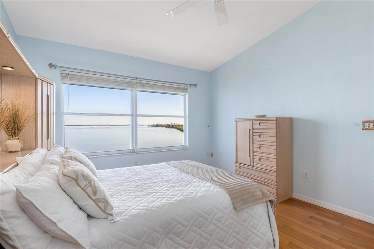 Primary Bedroom with spectacular views of the Peace River. Ensuite bath and walk-in closet.