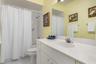 Guest bathroom with tub/shower combination.