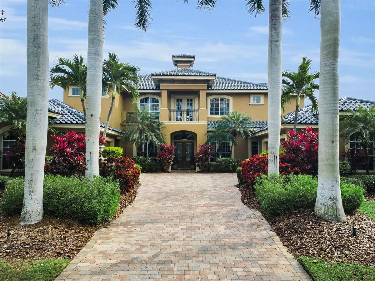 Timeless Mediterranean architecture with elegant stucco façade and barrel-tile roof