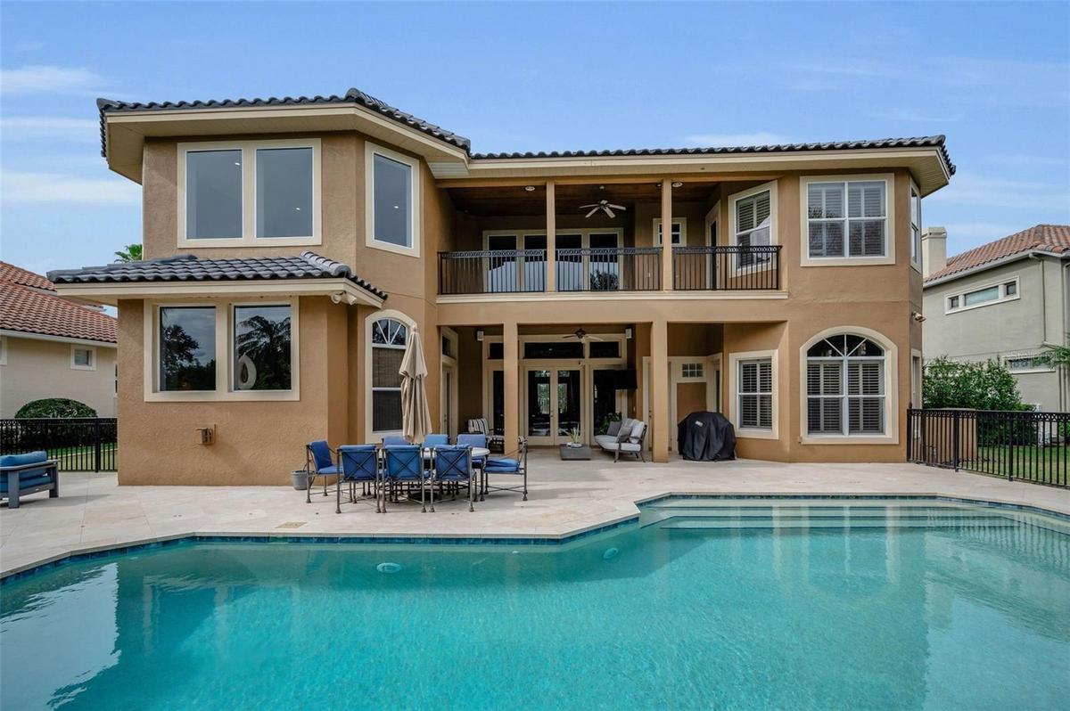 Striking rear elevation showcasing the home’s Mediterranean architecture from every angle
