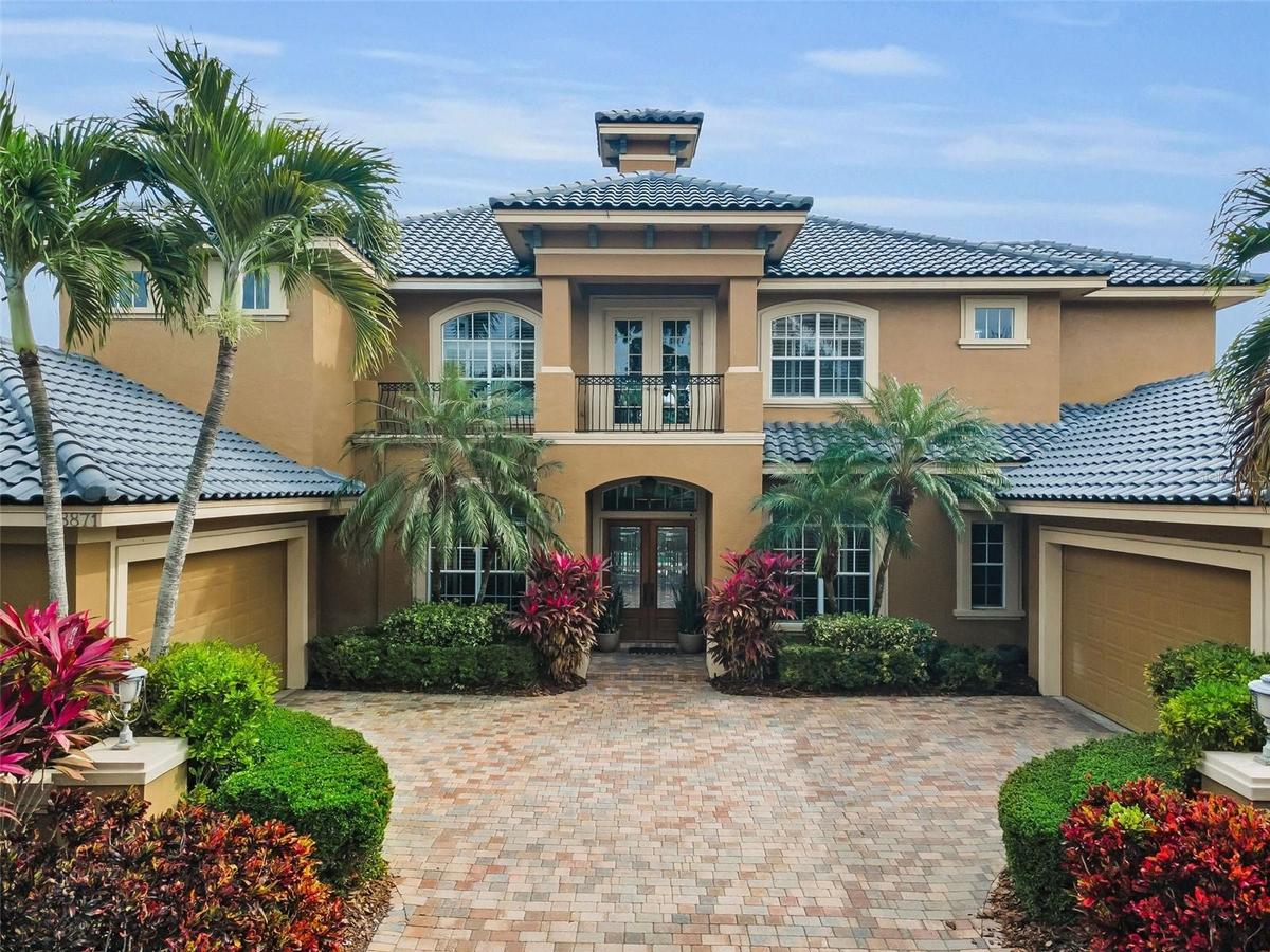 Timeless, upscale aesthetic with an arched entry and grand double door!