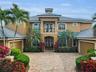 Timeless, upscale aesthetic with an arched entry and grand double door!