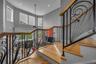 Beautiful wrought iron railings and wood flooring