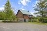 Standing Seam Metal Roof, Stone Trimmed Foundation, Slider to Dog Run