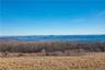 Rising steadily from east to west, the property reaches elevations of approximately 1,175 feet, where vast level areas capture commanding panoramic vi