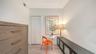 Den which easily functions as a 2nd bedroom, easily fitting queen size Murphy bed