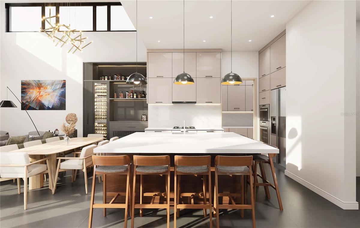 Kitchen with oversized island & a scullery kitchen as well featuring top tier appliances.