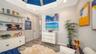This office/den is currently used as the perfect spot to relax, watch television, or listed to music