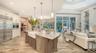 The photo shows the open concept floorplan with a peekaboo view into the bonus room to the left