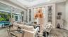Soaring ceilings and custom millwork are features of the great room of this spectacular home
