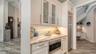 A separate beverage refridgerator and microwave make this the ideal coffee bar