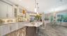 A large kitchen island, high end appliances and cabinetry are features of the kitchen, a Chef's delight!