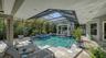 The heated pool is only one of the delights of this tiled, screened-in pool deck