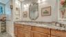 Built-in shelving allows you to display art pieces, photographs, colognes, and perfumes, with plentry of storage to tuck away your other toiletries.