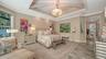 Custom lighting make this primary suite even more enchanting at night