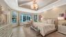 A beautiful chandelier and seating area are just two reasons to fall in love with the primary suite