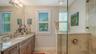 The third bathroom is situated in the hall between the third and fourth bedrooms