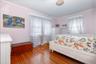 Hardwood flooring throughout, complemented by light-colored walls and white trim