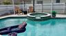 This screened pool screams decadence! Oversized deck for loads of seating, hot tub to relax all those sore muscles.