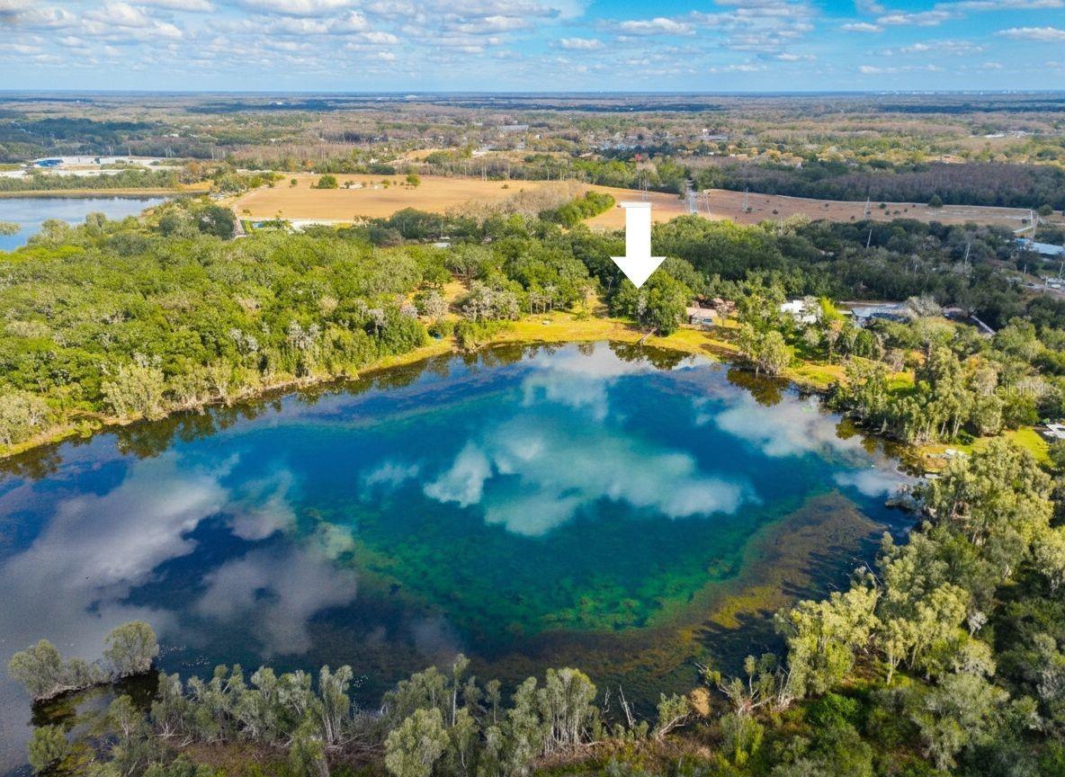 Single Family home on Lake Raleigh. Appx 18 Acre Spring Fed Lake