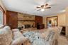 primary family room with wood burning fireplace