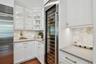 Showing off the lighted cabinets and the wine cooler.