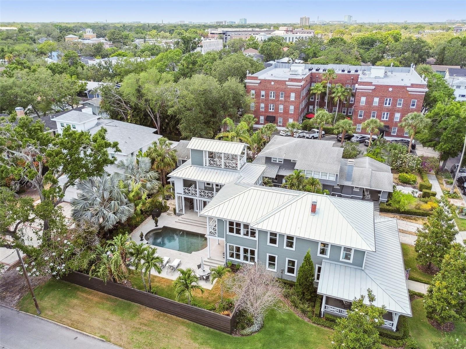 Note the Widow's Walk atop the Guest Wing.  Fencing and foliage create back yard privacy.