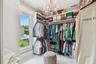 Primary closet and laundry.  Note the chandelier.